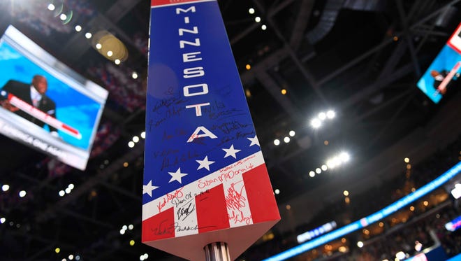 The Minnesota delegation sign is autographed by delegates during the 2016 Republican National Convention at Quicken Loans Arena July 21, 2016.