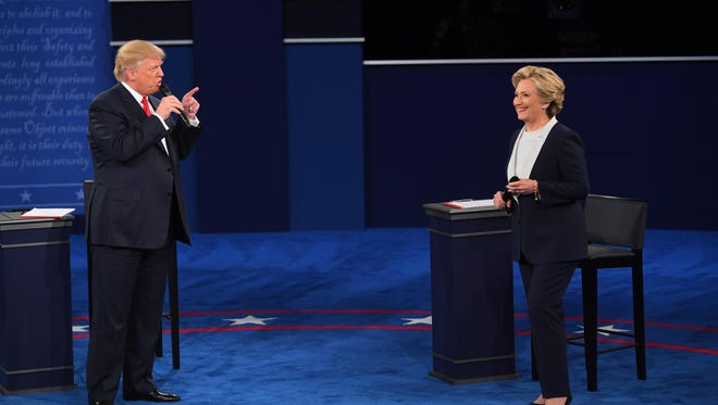 Oct 9, 2016; St. Louis, MO, USA;  Democratic presidential candidate Hillary Clinton and Republican presidential candidate Donald Trump during the second presidential debate at Washington University in St Louis. Mandatory Credit: Jack Gruber-USA TODAY NETWORK