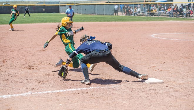 Mayfield's Zariah Caldwell slides into third base ahead of the tag from Piedra Vista's Jaden Lance on Thursday at Cleveland High School in Rio Rancho.