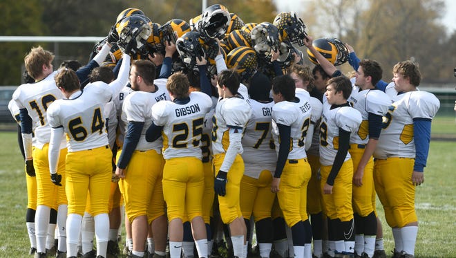 Climax-Scotts teammates gather as a team before Saturday's playoff against rival Mendon.