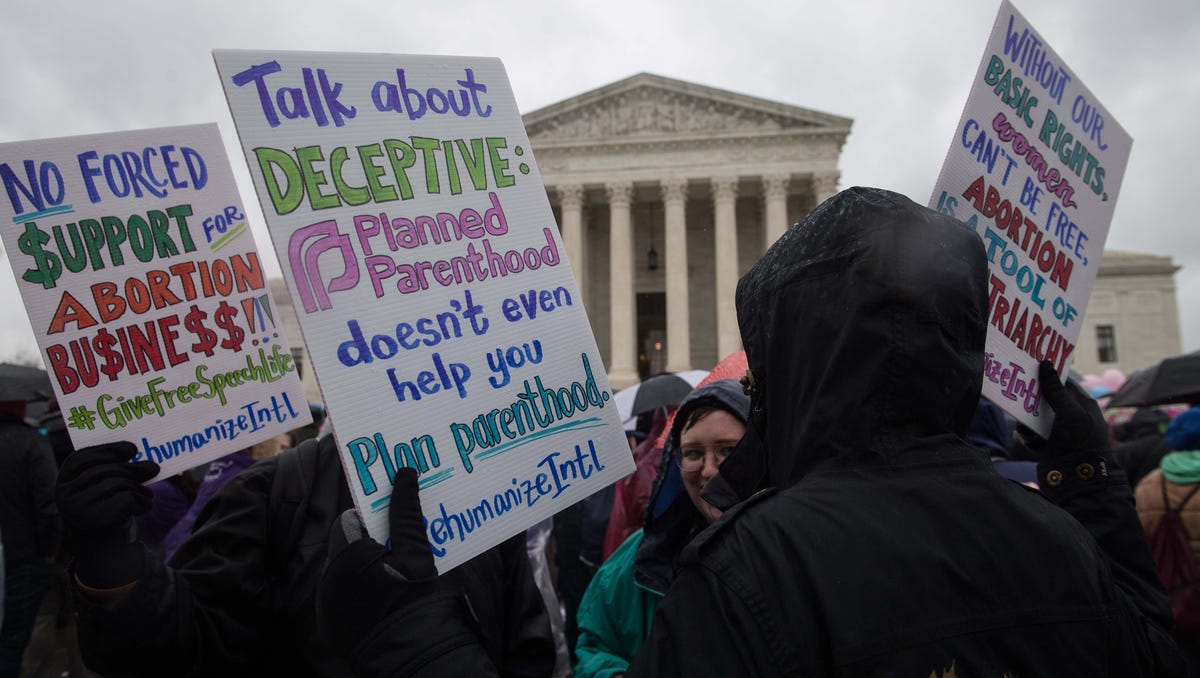 Anti-abortion activists demonstrated outside the Supreme Court in March as the court heard a challenge to a California law requiring anti-abortion pregnancy clinics to distribute information on family planning services.