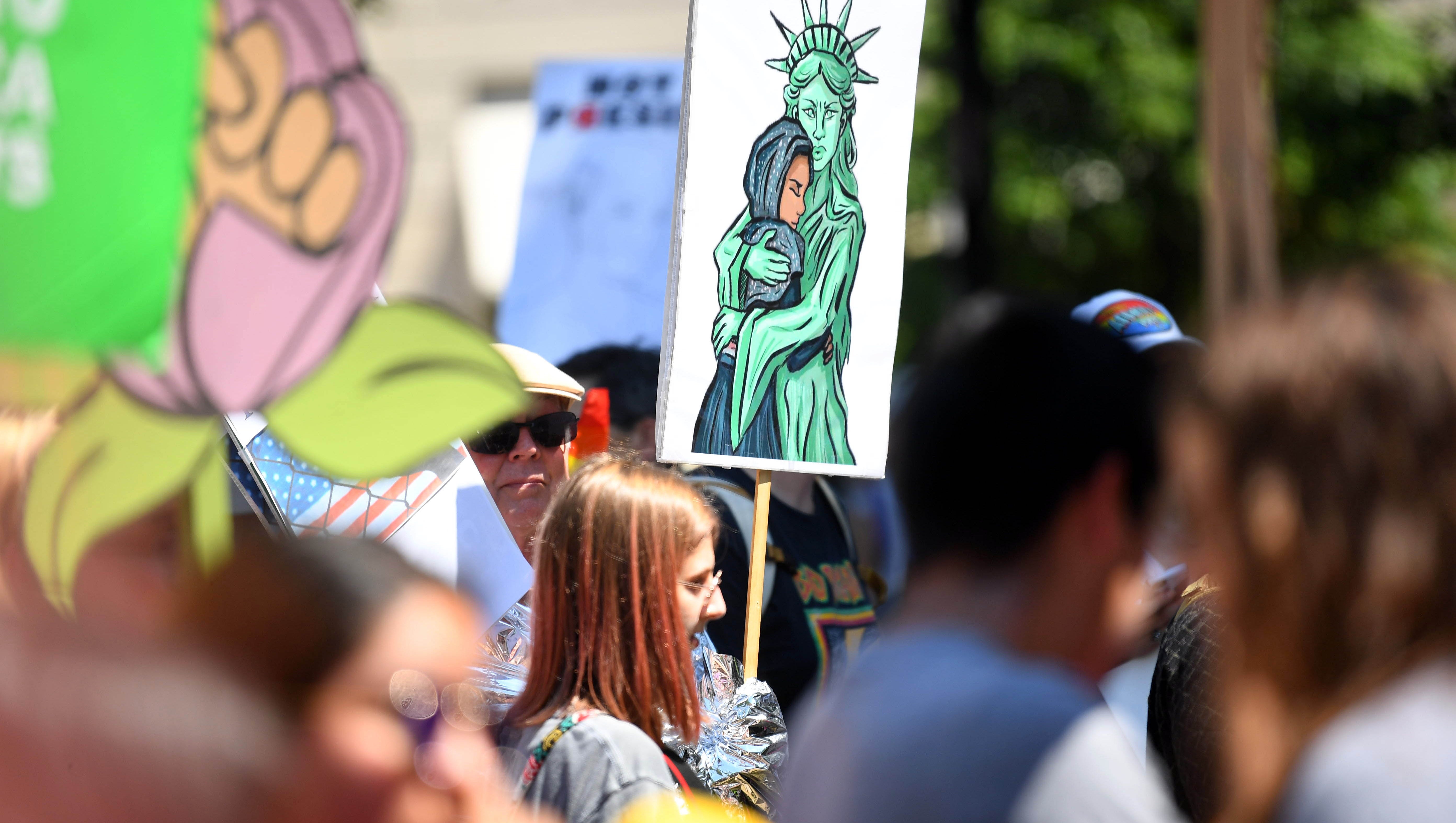 Protesters gather for the Families Belong Together
