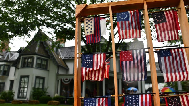 Some of America's original flags, with Ringwood Manor in the background, on July 4, 2018.