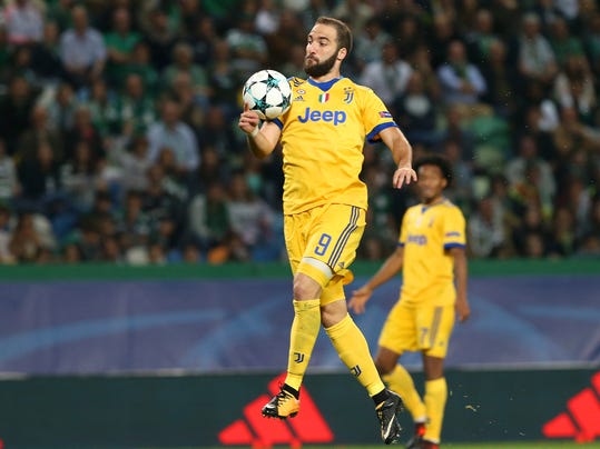 Juventus' Gonzalo Higuain stops the ball during a Champions League, Group D, soccer match between Sporting CP and Juventus at the Alvalade stadium in Lisbon, Tuesday, Oct. 31, 2017. (AP Photo/Armando Franca)