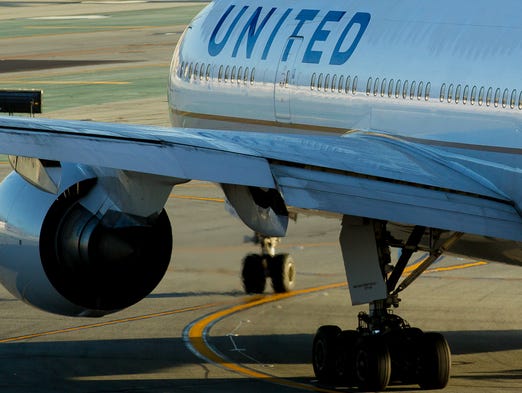 A United Airlines Boeing 777 taxies out for departure