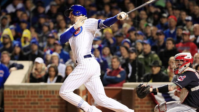 Kris Bryant hits a solo home run in the fourth inning for the Cubs.