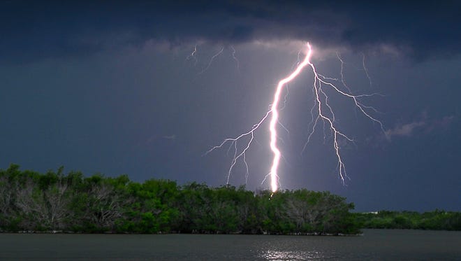 Thunderstorms rolled in over Brevard County Thursday evening with weather alerts and heavy rains. A lightning bolt lights up the sky over the Thousand Islands and the Banana River in Cocoa Beach Thursday evening as the storm passes through. 