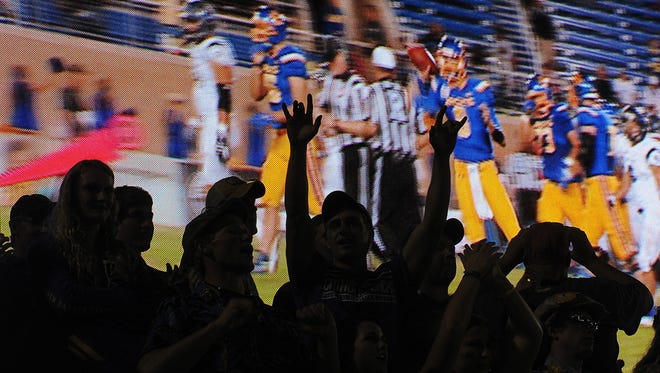 SDSU fans cheer at the end of a college football game against Robert Morris Saturday, Sept. 26, 2015, at Coughlin-Alumni Stadium in Brookings, S.D. SDSU topped Robert Morris 34-10.