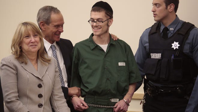 Shaul Spitzer, a New Square man convicted of trying to burn down a dissident's house in court with his attorneys after a judge granted him youthful offender status at his resentencing Tuesday, which will result in his release from jail.