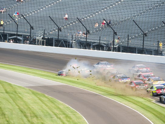 Cars tangle in turn one following a restart of the