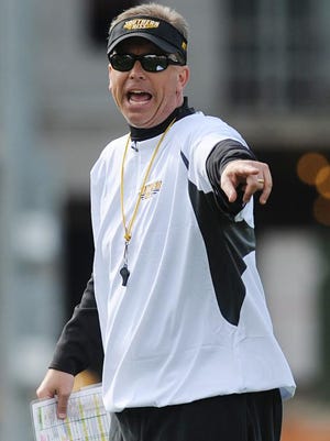 Southern Miss football coach Todd Monken calls a play recently during a spring practice.