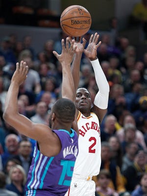 Indiana Pacers guard Darren Collison (2) shoots a three-pinter over Charlotte Hornets guard Kemba Walker (15) in the first half of their game at Bankers Life Fieldhouse on Tuesday, April 10, 2018. 