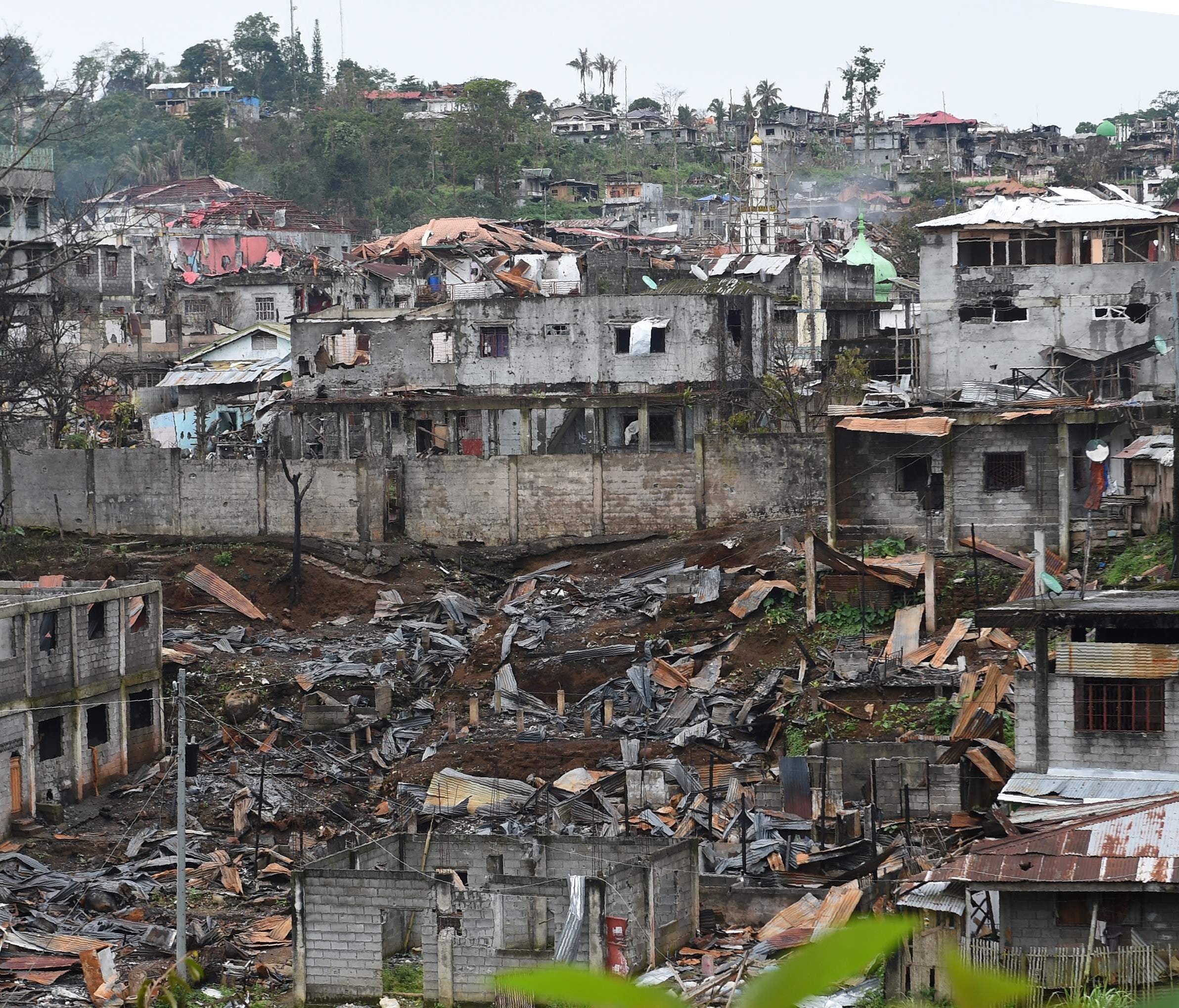 Destroyed buildings are seen from a government sniper's position on the front line in Marawi, Philippines, on July 22, 2017.