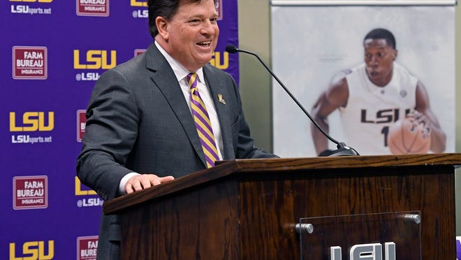 Scott Woodward answers questions after being introduced as the new Director of Athletics at LSU, Tuesday April 23, 2019, in Baton Rouge, La. Woodward, who graduated from LSU in 1985, was the Vice-Chancellor of External Affairs at his alma mater under former Chancellor Mark Emmert from 2000-2004. Woodward spent time at Washington and Texas A&M before accepting the job at LSU as a replacement for Joe Alleva. (Bill Feig/The Advocate via AP)