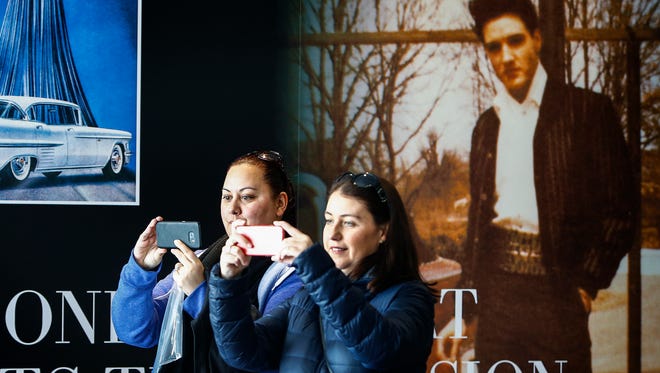 New Zealanders Suia Drodrolagi (left) and Bridget Fogarty (right) tour the Elvis Presley's Museum during a Brand USA tour. Brand USA officials warn federal budget cuts could cripple efforts to promote US tourism. 