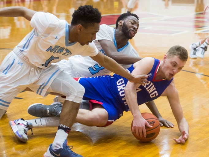 Spring Grove's Jacob Messersmith (14) holds onto a