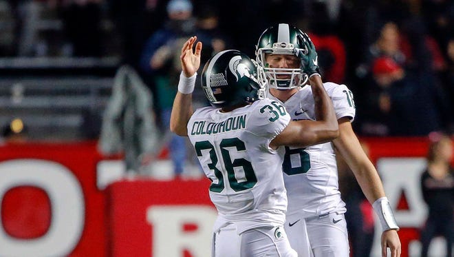 Oct 10, 2015; Michigan State Spartans cornerback Arjen Colquhoun (36) celebrates with quarterback Connor Cook (18) at High Points Solutions Stadium.