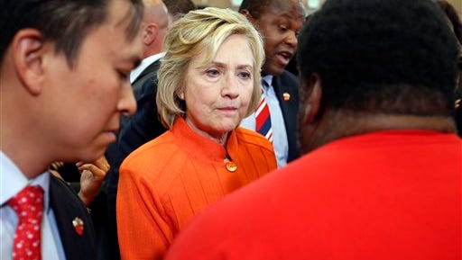 In this Aug. 18, 2015, photo, Democratic presidential candidate Hillary Rodham Clinton speaks with people at a town hall meeting in North Las Vegas, Nev. Clinton's campaign is facing fresh worries among congressional Democrats about her use of a private email account while serving as secretary of state. Poll results suggest the inquiry may be taking a toll on her presidential campaign. (AP Photo/John Locher)
