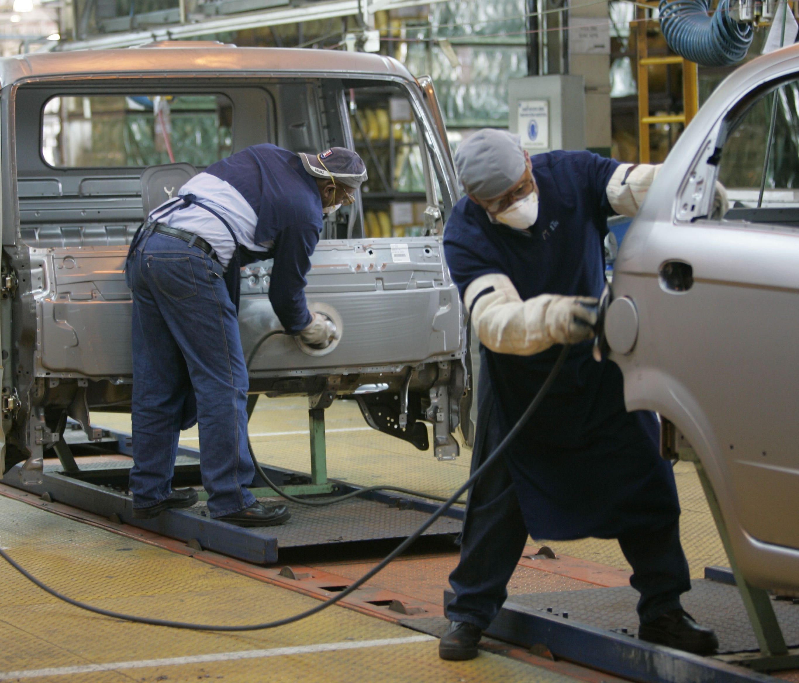 Workers on the assembly line at the General Motors assembly plant in Valencia, Venezuela, in a 2007 file photo