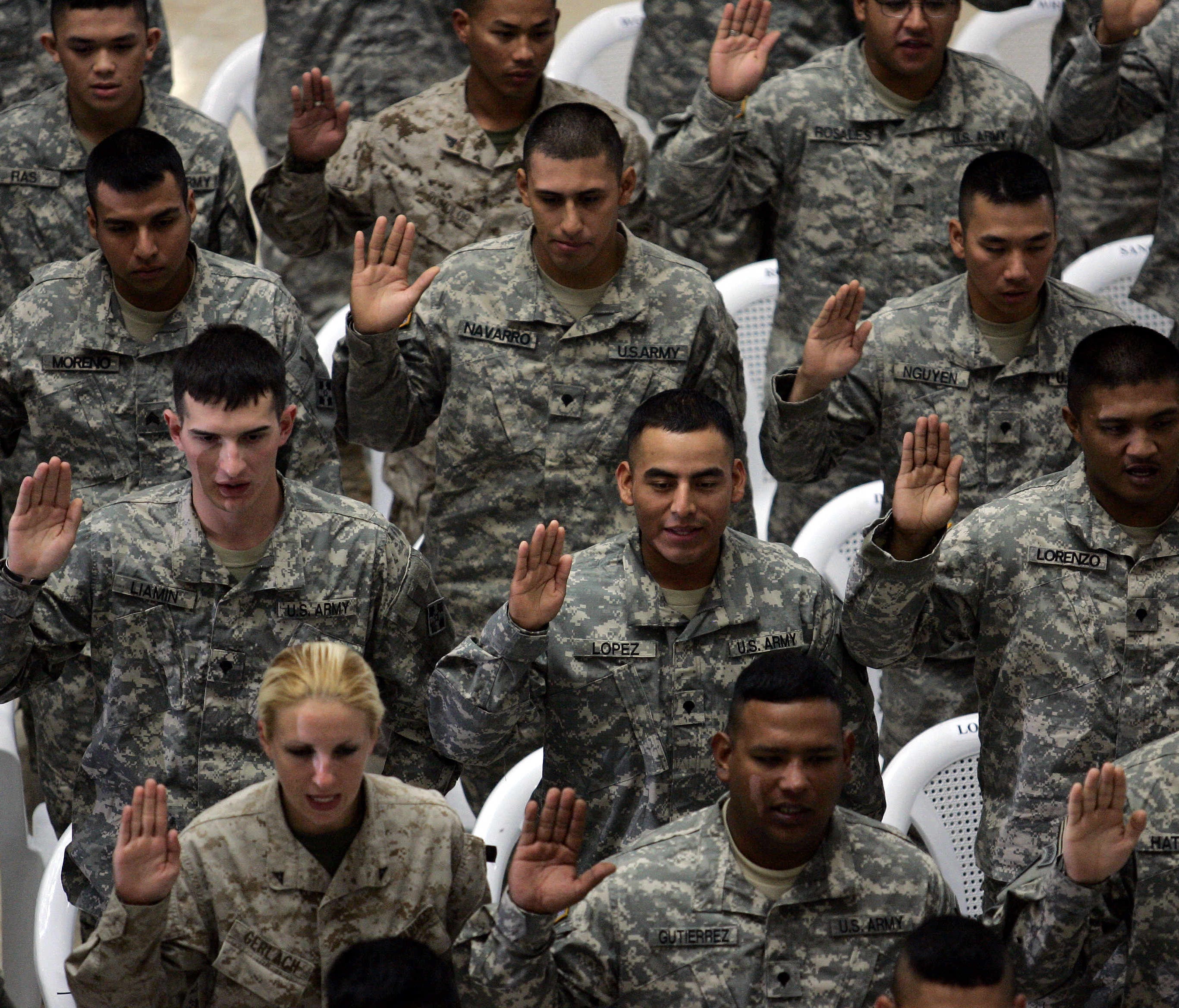 A diverse group of U.S. soldiers are sworn in as citizens in 2006.