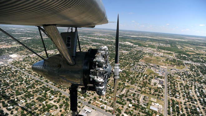 A 1928 Ford Tri-Motor flies over the city of Abilene on Thursday, May 4, 2017. 