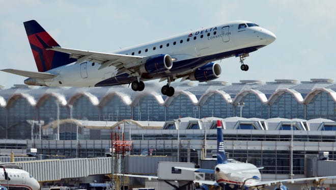 A Delta Air Lines jet takes off from Ronald Reagan Washington National Airport in Arlington, Va.