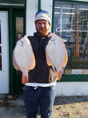 Pat Murphy, Toms River, with a pair of winter flounder.