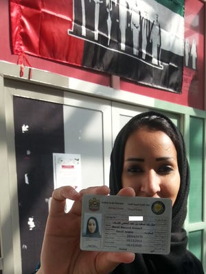 Saudi rights activist Manal al-Sharif displays her UAE driving license.