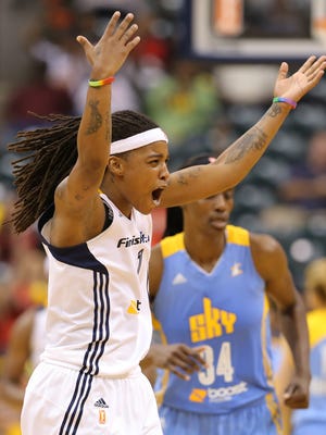 Indiana Fever guard Shavonte Zellous celebrates a late three-point basket to take a 6 point lead against the Chicago Sky during the first game of the Eastern Conference Finals inside Bankers Life Fieldhouse, on Saturday, August 30, 2014, in Indianapolis.