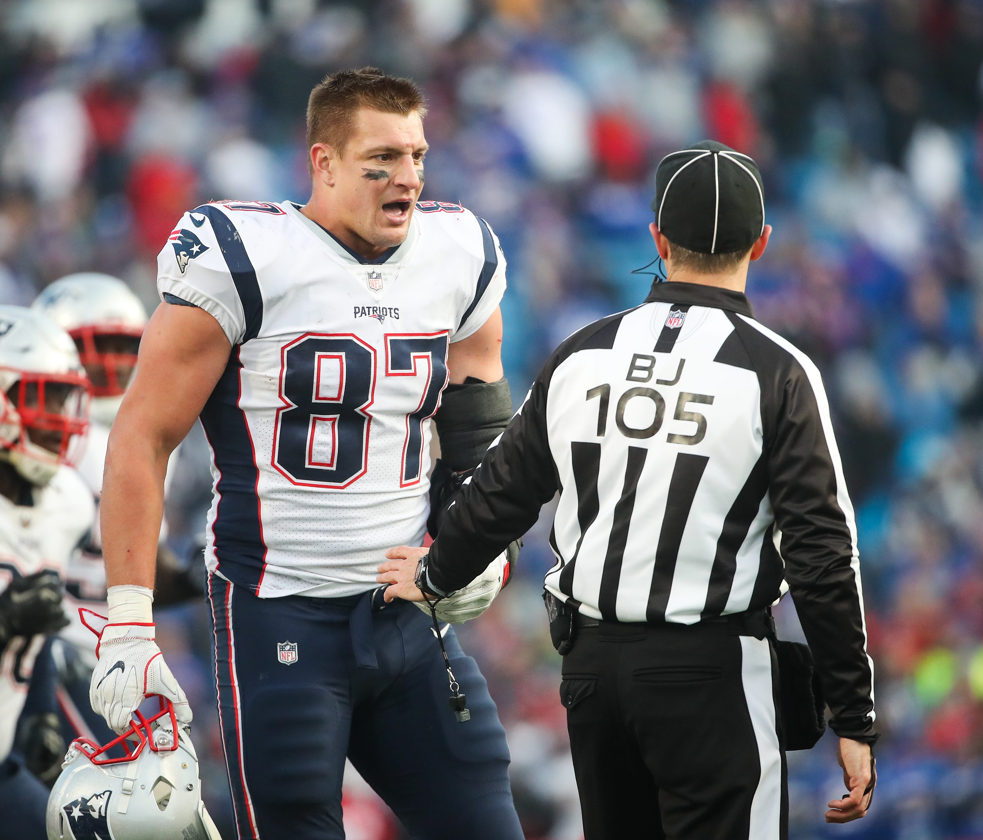 ORCHARD PARK, NY - DECEMBER 3:  Rob Gronkowski #87 of the New England Patriots talks with back judge Dino Paganelli #105 during the fourth quarter against the Buffalo Bills on December 3, 2017 at New Era Field in Orchard Park, New York.  (Photo by To