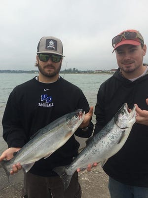 Zack Hilbert with a steelier and Jake Van Camp with a coho, both caught on the south pier in Sheboygan.