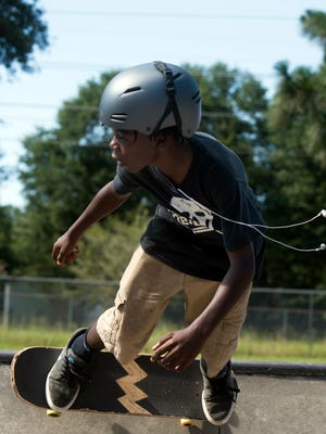 Cedarius Johnson practices his skating skills Thursday at the Steven Morgan Skate Park in Milton. Milton City Councilman Jeff Snow wants the city to change an ordinance to allow bicycles to use the skate park.