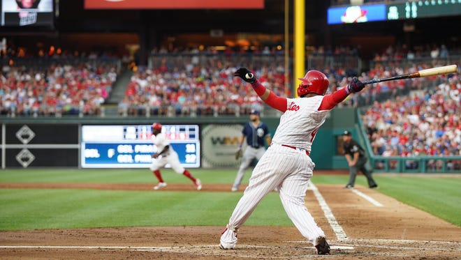 Jul 20, 2018; Philadelphia, PA, USA; Philadelphia Phillies first baseman Carlos Santana (41) hits a three RBI home run during the second inning against the San Diego Padres at Citizens Bank Park. Mandatory Credit: Bill Streicher-USA TODAY Sports