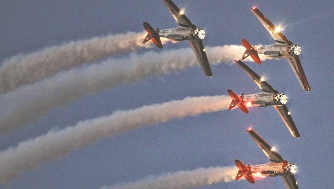 Acrobatic planes perform at the annual EAA AirVenture held in Oshkosh. The event provides a platform to expand an aviation hub for the region, experts believe.
