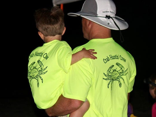 Levi Hughes embraces his dad, Jonathan, during the