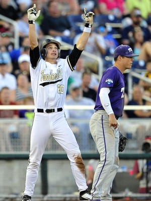 Vanderbilt’s Bryan Reynolds, left, celebrates a triple in the fifth inning Friday.