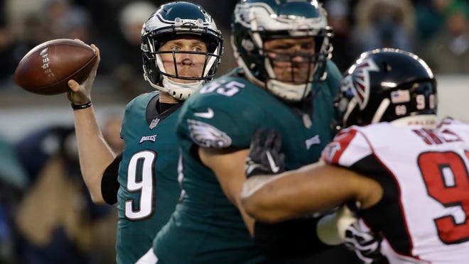FILE - In this Saturday, Jan. 13, 2018, file photo, Philadelphia Eagles' Nick Foles throws a pass during the first half of an NFL divisional playoff football game against the Atlanta Falcons,, in Philadelphia. The Philadelphia Eagles host the Minnesota Vikings in the NFC championship on Sunday. (AP Photo/Matt Rourke, File)