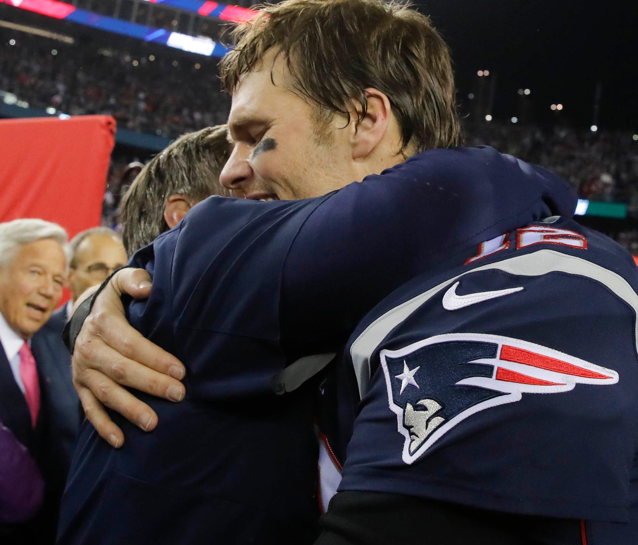 Patriots head coach Bill Belichick hugs quarterback Tom Brady  after the AFC Championship Game.