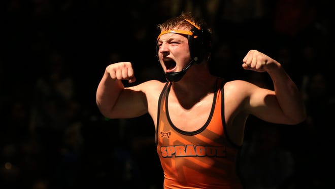 Sprague's Landon Davis celebrates winning the 170 pound weight class finals of the Greater Valley Conference district wrestling championships at McKay High School in Salem on Saturday, Feb. 3, 2018.