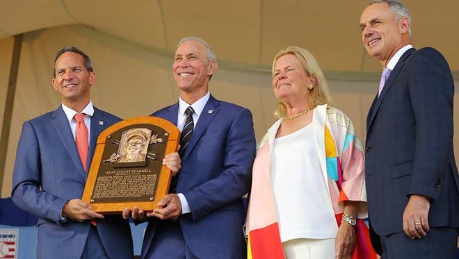 Former Tigers shortstop Alan Trammell (second from left) holds his plaque during the Baseball Hall of Fame induction ceremony Sunday in Cooperstown, N.Y.