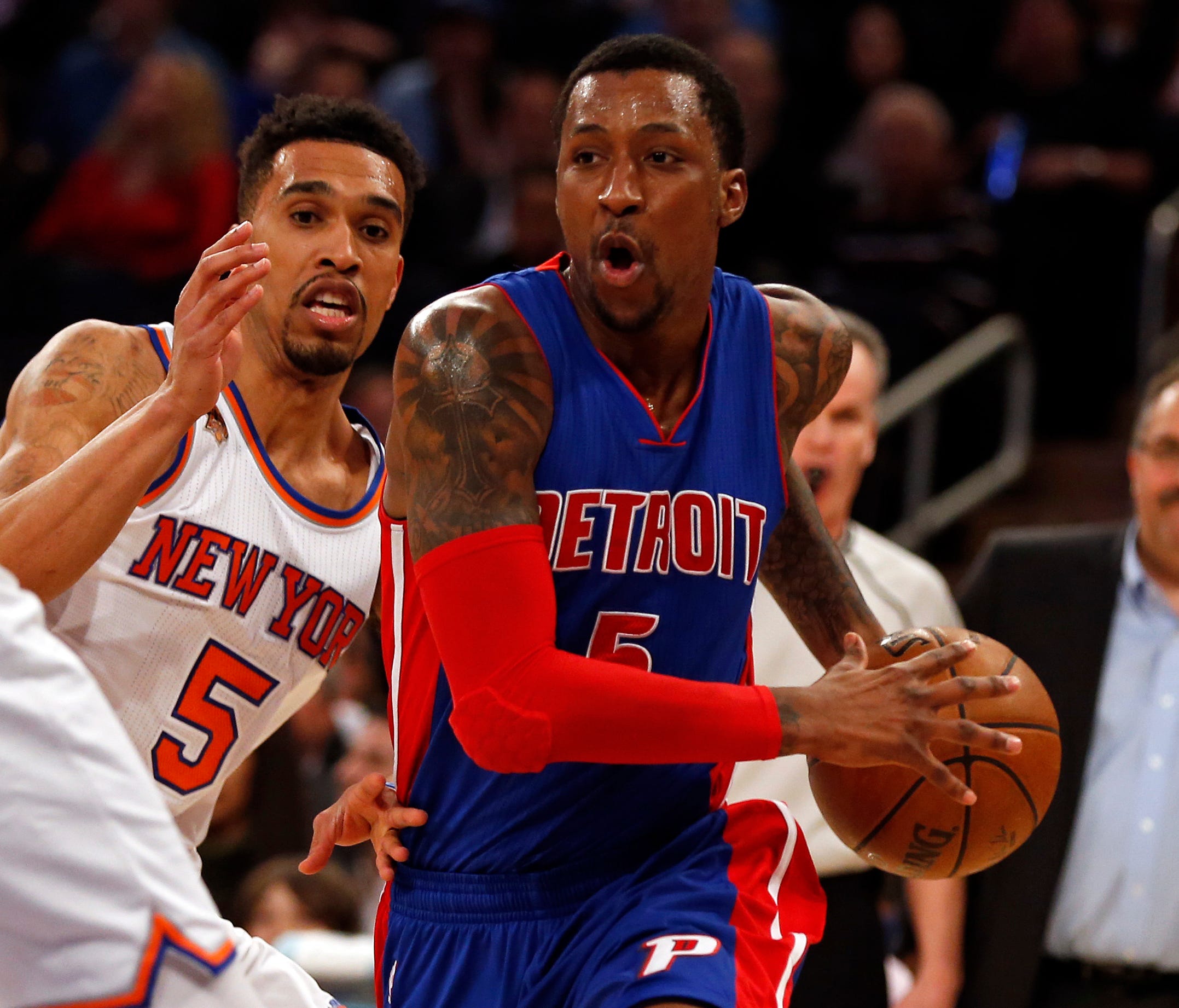 Detroit Pistons guard Kentavious Caldwell-Pope (5) drives to the basket past New York Knicks guard Courtney Lee (5) during the first quarter at Madison Square Garden.