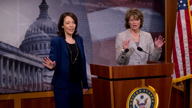 Senate Energy and Natural Resources Committee Chair Sen. Lisa Murkowski, R-Alaska, right, accompanied by the committee's ranking member, Sen. Maria Cantwell, D-Wash., speak about energy policy modernization during a news conference on Capitol Hill in Washington on Wednesday.