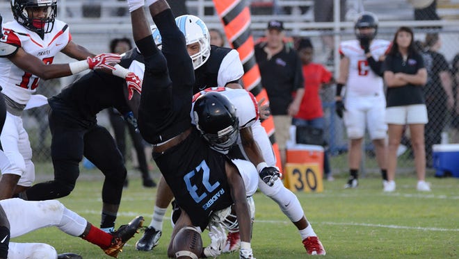 Rockledge Raider Vaurice Griffin Jr is upended in the opening kickoff Friday night in their home game against the Palm Bay Pirates