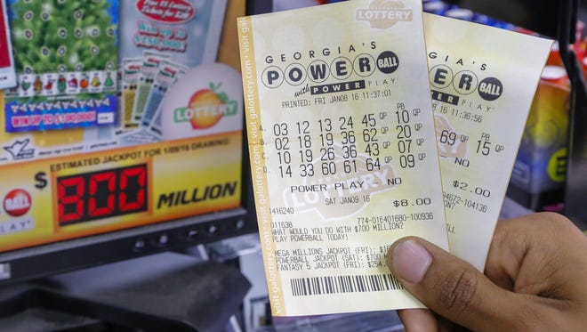 A customer shows his tickets for the multi-state Powerball lottery jackpot, the largest in US history, at a convenience store in Madison, Georgia, USA, 08 January 2016.