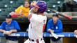 Clemson first baseman Andrew Cox (6) connects for a