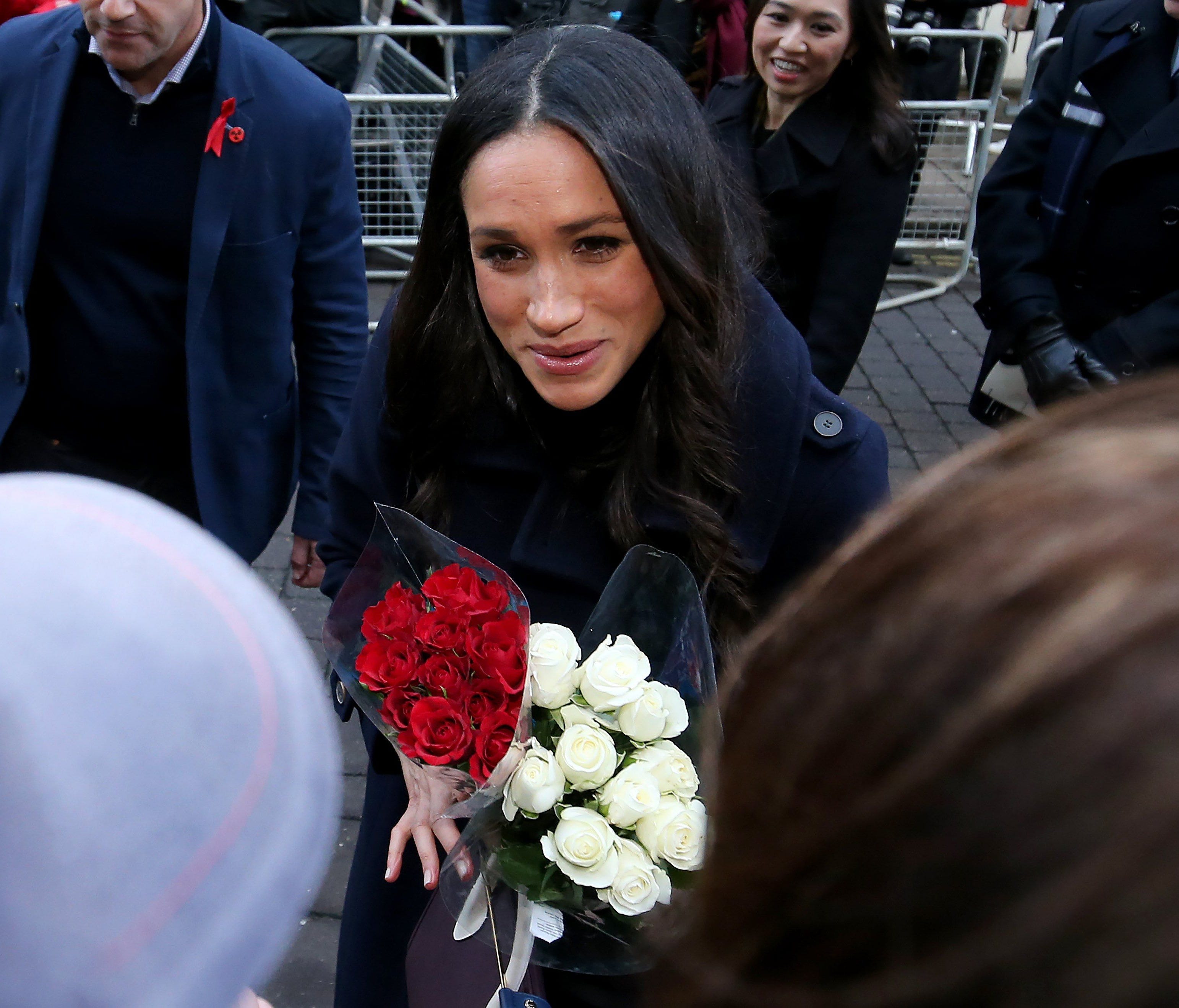 Britain's Prince Harry (unseen) and his fiancee U.S. actress Meghan Markle visit the Terrence Higgins Trust World AIDS Day charity fair at the Nottingham Contemporary, Britain, Dec. 1, 2017.