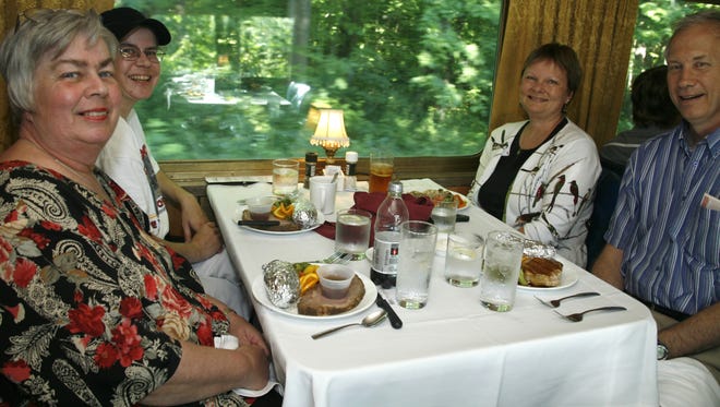 d0717diner3sm
Passengers from left, Shirley Foels, Christa Parker, Carol and Gordy Gaustad, enjoy their dinner aboard the Boone and Scenic Valley Railroad on Saturday.  (Sally Morrow/Des Moines Register)