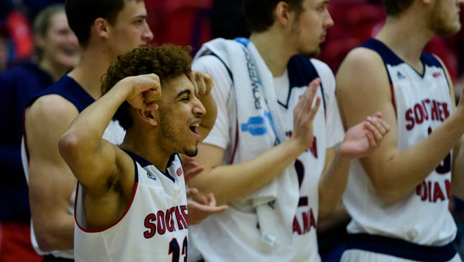 USI's Humaad Khan (13) reacts to his team coming back from their 11-point deficit in the second half to tie up the game against the Lewis University Flyers before going into overtime at USI's Physical Activities Center in Evansville, Ind., Thursday, Nov. 30, 2017. After going into overtime, the Screaming Eagles defeated the Flyers, 84-75.