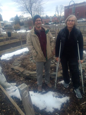 Scott Lauffer and Kathy Cronin look over the Gregory Lane community garden in Binghamton’s First Ward. They serve as volunteer garden coordinators.