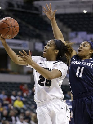Purdue Boilermakers guard April Wilson (25) drives by Penn State Lady Lions guard Teniya Page (11) in the second half of their Big Ten Women's Basketball Tournament game Thursday, Mar 3, 2016, at Bankers Life Fieldhouse in Indianapolis.